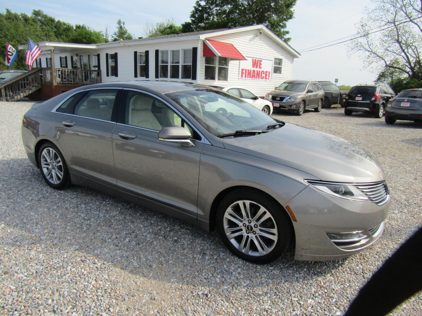 2015 Silver /Tan Lincoln MKZ FWD (3LN6L2GK9FR) with an 3.7L V6 DOHC 24V engine, Automatic transmission, located at 15016 S Hwy 231, Midland City, AL, 36350, (334) 983-3001, 31.306210, -85.495277 - Photo#0